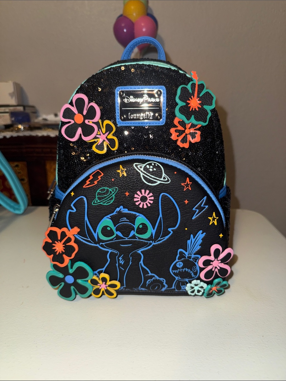 Loungefly Black Mini Backpack with Neon Blue Stitch & Multicolor Floral Accents
